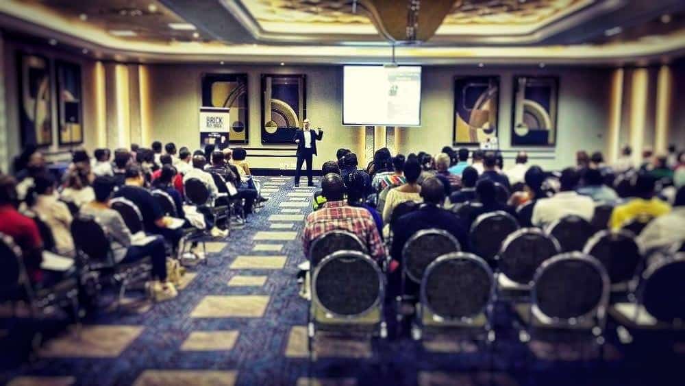 public speaker on the stage presenting keynote